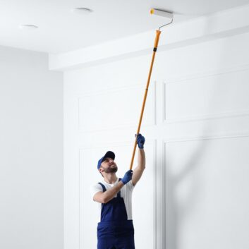 Professional painting a white wall
